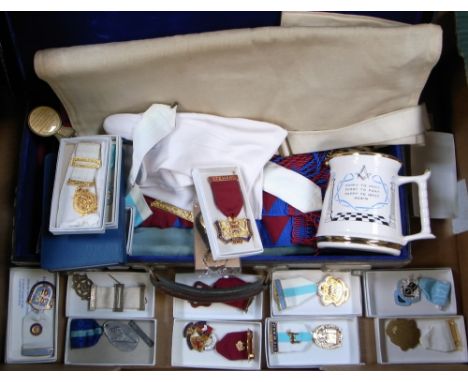 A quantity of Masonic regalia for Brother Roger Platt, including base metal jewels, leather pouch, sash etc.