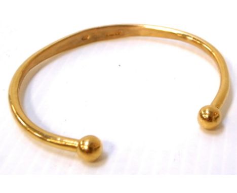 A 22ct gold bangle, approx weight 19.4g.  CONDITION REPORT Slightly misshapen at the top.