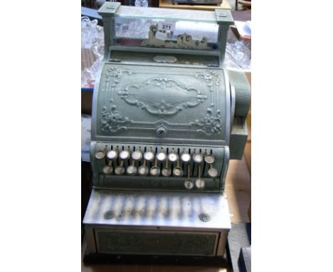 A vintage cash register with raised floral decoration (af). CONDITION REPORT Does not appear to be functioning.