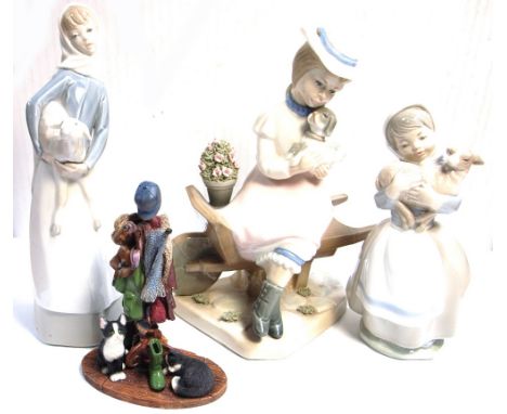A Nao figurine of a young girl holding a lamb, a Lladro figurine of a young girl holding a lamb, a Spanish figurine and one o