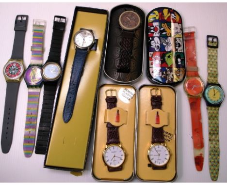 A quantity of modern fashion watches to include four examples by Swatch, three examples by Fahrenheit and a Warner Brothers c