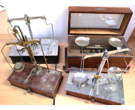 Four sets of pharmaceutical chemical or balance scales to include to include May Roberts and Co. Ltd of London, Henry Troemne