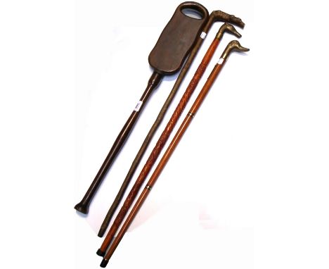 A early 20th century seat stick, two 20th century brass handle canes, one with a drinking phial and a further cane (4).