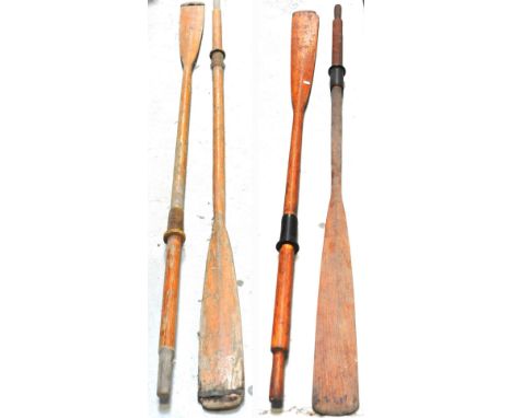Two pairs of vintage rowing oars.