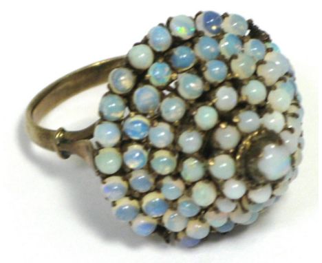 A yellow metal and opal set large dress ring, stamped 14k, size O. CONDITION REPORT There are four small opals missing from t