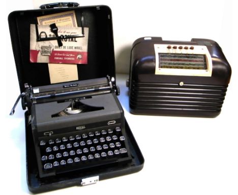 A vintage brown bakelite Bush radio and a New Royal Quiet Deluxe portable typewriter (2).
