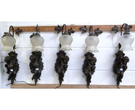 Five matching wall light fittings of cherubic form, length 63cm (5).