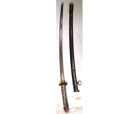 An early 20th century Katana Japanese dress sword with textured grip and original scabbard.