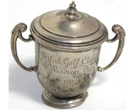 A George VI hallmarked silver twin handled trophy cup and cover of small proportions inscribed "York Golf Club, Wardrop cup 1