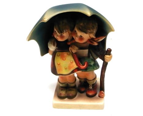A Goebel figure group "Stormy Weather", height 15cm.