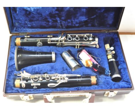 A cased Evette clarinet.