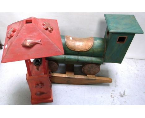 A green painted wooden train on rockers and an ornamental large wooden red painted garden lamp (2).
