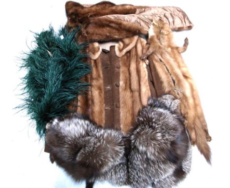 A vintage suede coat with fur collar, two fox fur collars, a mink wrap, a fox shrug, some mink collars and a green feather bo