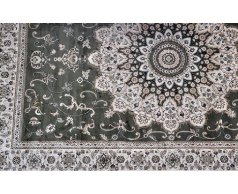 A green ground Tabriz carpet, 280 x 200cm.