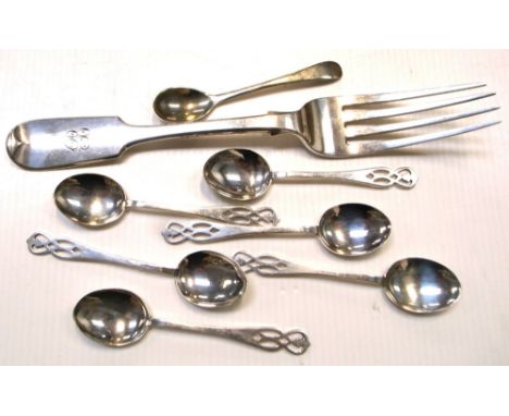 A Victorian hallmarked silver fiddle pattern fork, London 1846 and six hallmarked silver coffee spoons with Celtic design fin