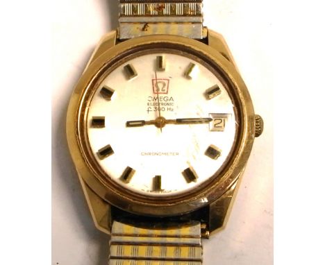 Omega; a 9ct gold gentlemans electronic F300Hz chronometer wristwatch with circular dial set date aperture and raised batons,