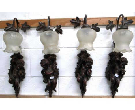Four matching wall light fittings of cherubic form, length 53cm (4).
