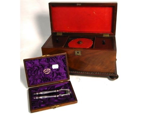 A 19th century three section mahogany tea caddy of rectangular form on bun feet, two Oriental lacquer match boxes and a cased
