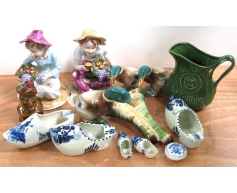 Three mallard ducks, an Ardbeg whiskey jug and matching wall pocket, a small Scotsman containing whiskey, two ceramic figures