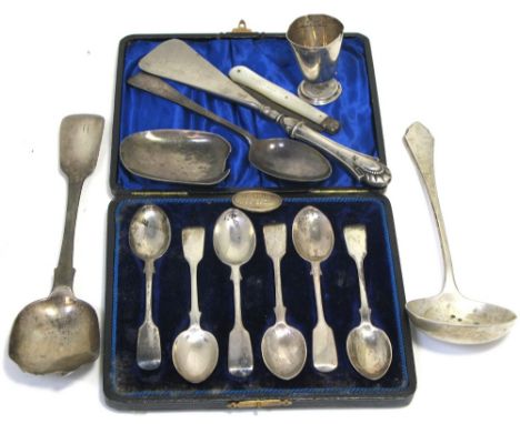 A cased set of six Victorian hallmarked silver teaspoons, London 1894, a George V hallmarked silver ladle, Sheffield 1926, a 