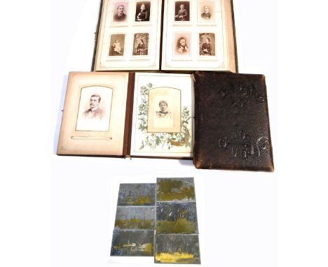 Three Edwardian black and white photograph albums, predominately containing portrait photographs.