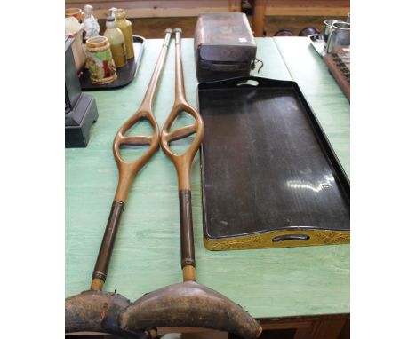 A pair of vintage carved wooden spring loaded crutches, Japanese gilt and black lacquer tray plus a small leather case
