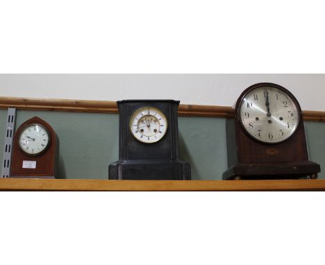 A mahogany Junghams dome top striking mantel clock, an Edwardian inlaid mahogany clock plus a black marble clock