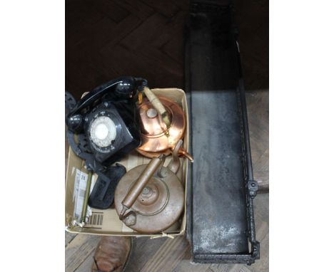 A Victorian iron fender, two trivets, toasting fork, black telephone plus two copper kettles