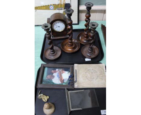 A mahogany wall mirror, oak mantel clock, barley twist candlesticks plus other items (two trays)