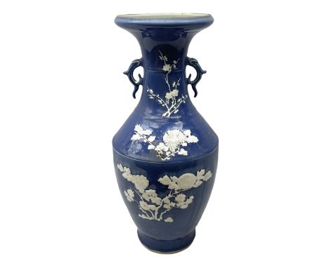 Chinese blue and white floor vase, applied decoration in white with blossoming branches on light blue ground, with moulded tw