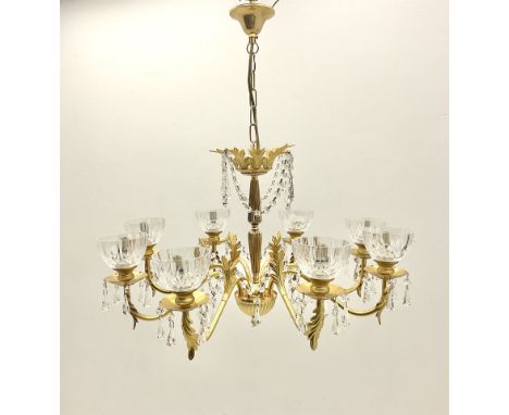 Gilt metal and glass mounted eight branch acanthus chandelier, the shaped stem with eight scrolling branches with glass drip 