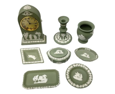 Collection of Wedgwood sage green Jasperware to include mantel clock decorated with classical scene, candlestick, trinket dis