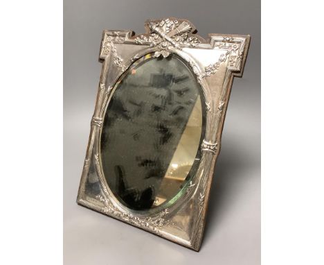   An Edwardian silver mounted easel mirror, with oval plate, James Deakin &amp; Sons, Birmingham, 1908, 29.8cm.