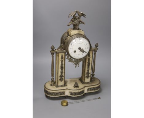   A late 19th century French alabaster mantel clock, dial signed Huvelliez
