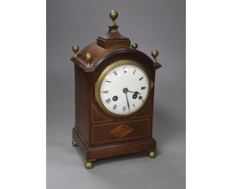   An inlaid mahogany mahogany mantel clock with brass ball finials, height 28cm