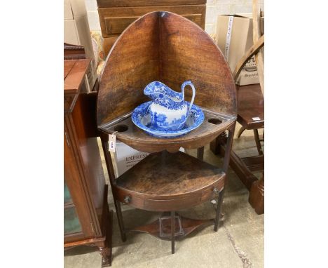   A George III corner washstand, width 62cm, depth 41cm, height 121cm together with a Spode blue and white jug and basin