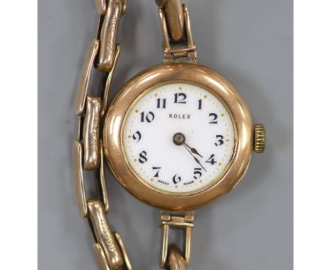   A lady's early 20th century 9ct gold Rolex manual wind wrist watch, on a 9ct flexible bracelet (no glass),case diameter 25m