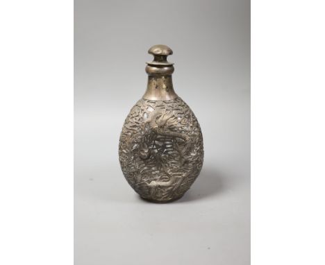   A Chinese pierced white metal mounted dimpled decanter with stopper,height 23.5cm.