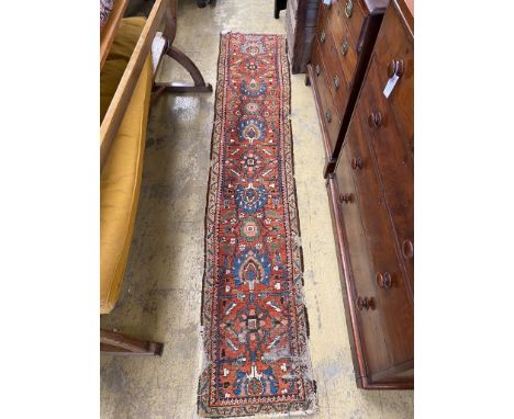   A Caucasian red ground runner, 284 x 59cm
