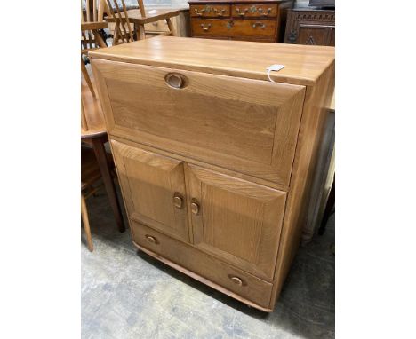   An Ercol elm fall front cabinet, width 82cm depth 44cm height 110cm