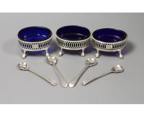   A set of three George III oval pierced silver salts, D &amp; R Hennell, London 1771, 81mm and four bright cut spoons.