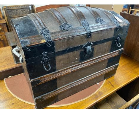   A Victorian iron mounted domed top trunk with street iron mounts, length 81cm, depth 49cm, height 60cm