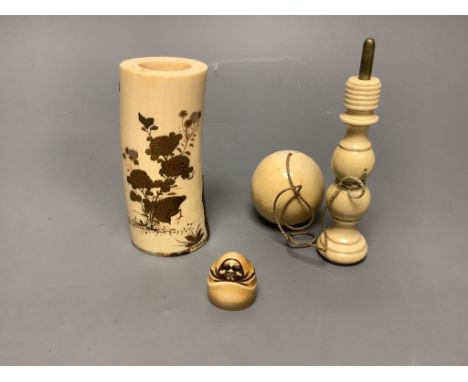   A Japanese gilt lacquered ivory vase, 11.2cm high, a 19th century ivory cup and ball game and an ivory netsuke of Daruma