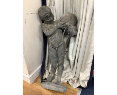   A lead figure of a boy carrying a water pitcher (a.f.),