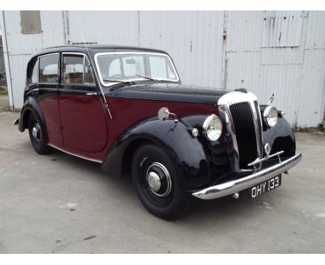 A 1952 Daimler DB18 Consort, registration number OHY 133, black over maroon. Daimler introduced the new DB18 just before the 