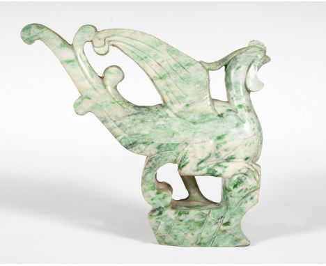 China, early 20th century.Green jade carving.  Measurements: 15 x 16 cm.Ornamental piece in round bulk, entirely carved in ja