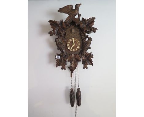 A German double weight Cuckoo clock, 49cm tall, working order 