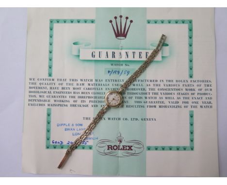 A 9ct yellow gold ladies 1955 Rolex manual wind bracelet wristwatch with original guarantee, 18mm case, 18cm strap, total wei
