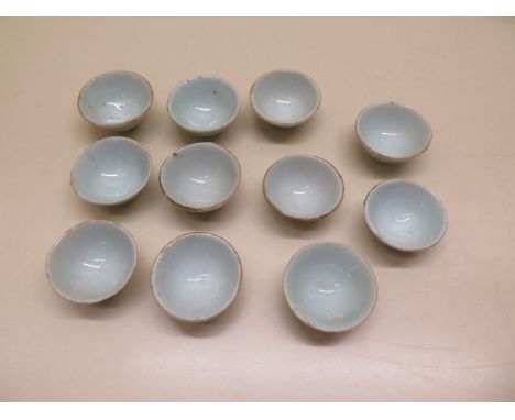 Eleven blue glaze ceramic saki cups, 4.5cm diameter 