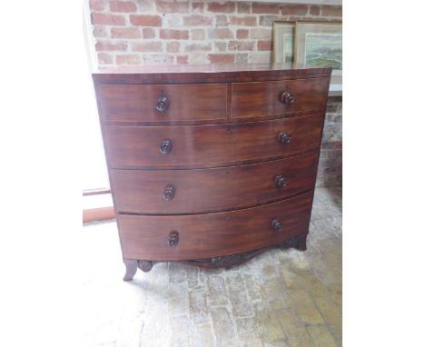 A 19th century mahogany bowfronted five drawer chest on splayed bracket feet united by a carved apron, 114cm tall x 115cm x 6